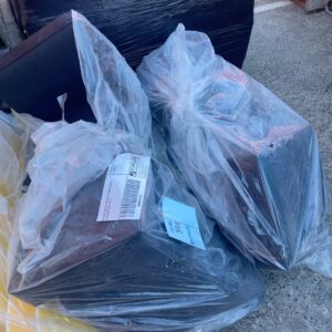 EX HIRE BAG OF BLACK OUTDOOR COUCH CUSHIONS SOLD AS IS