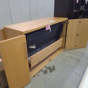SECOND HAND FURNITURE - BLONDE LAMINATE STORAGE UNIT WITH FOLD OUT BED INSIDE SOLD AS IS