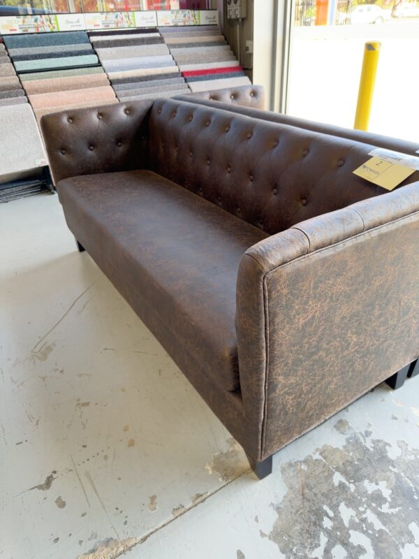 EX HIRE CHOCOLATE PU 3 SEATER COUCH SOLD AS IS