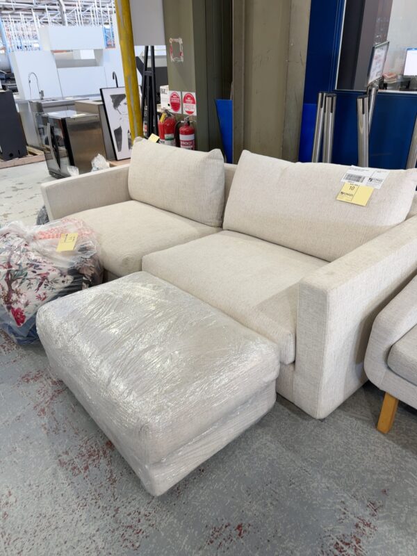 EX HIRE CREAM GREY FABRIC COUCH WITH OTTOMAN SOLD AS IS