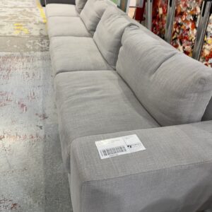 EX HIRE GREY MATERIAL LARGE 4 SEATER SECTIONAL COUCH SOLD AS IS