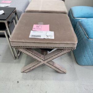 EX STAGING FURNITURE - LATTE VELVET OTTOMAN WITH CROSS LEG, STUD DETAIL 
SOLD AS IS