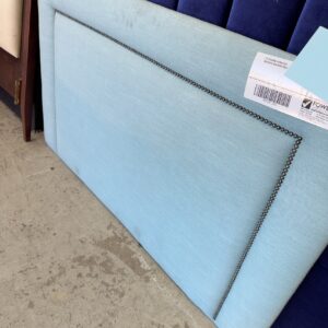 EX STAGING FURNITURE - LIGHT BLUE MATERIAL BEDHEAD SOLD AS IS
