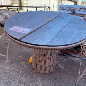 EX STAGING FURNITURE, TIMBER & RATTAN OUTDOOR TABLE, TIMBER TABLETOP WARPED, SOLD AS IS