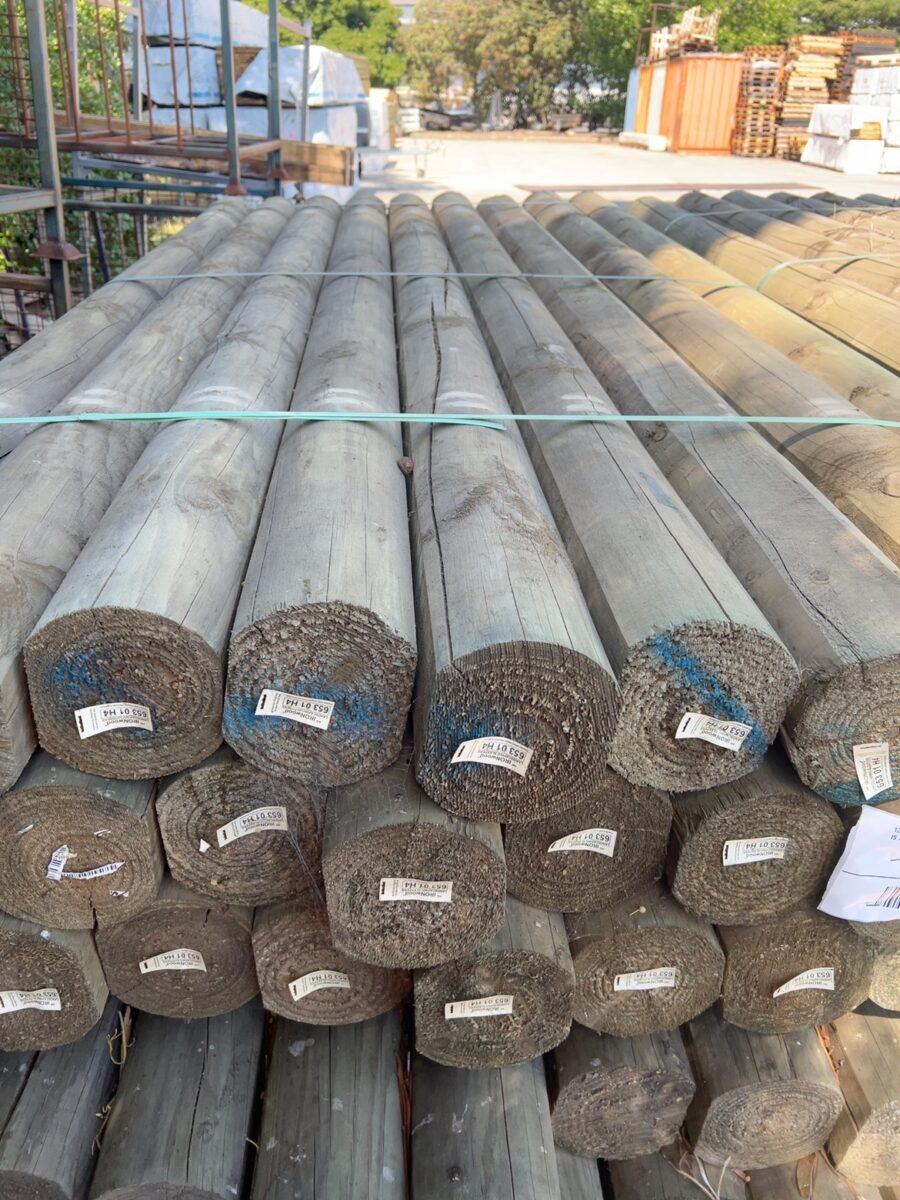 125MM TREATED PINE SLABS-26/2.4 (A SLAB IS A SUPERROUND POLE WITH SHAVED SIDES)