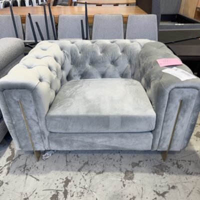 EX STAGING FURNITURE - LARGE OVERSIZE GREY VELVET BUTTON UPHOLSTERED ARMCHAIR, SOLD AS IS