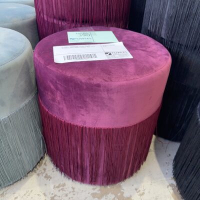 EX HIRE - BURGUNDY VELVET ROUND OTTOMAN WITH TASSLE FRINGE, SOLD AS IS