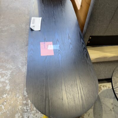 EX STAGING FURNITURE - OVAL BLACK TIMBER COFFEE TABLE, SOLD AS IS