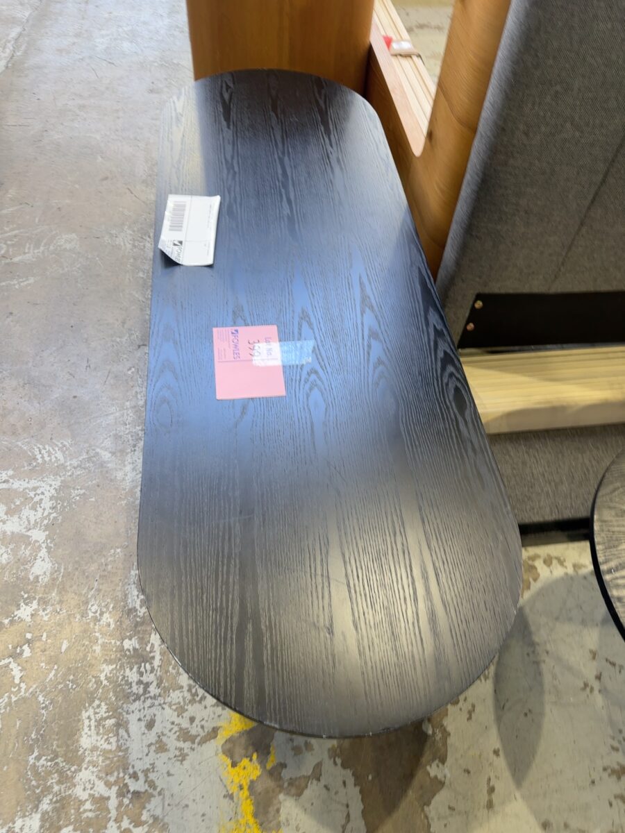EX STAGING FURNITURE - OVAL BLACK TIMBER COFFEE TABLE, SOLD AS IS
