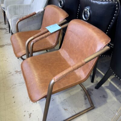 EX STAGING FURNITURE - BROWN PU CHAIR, SOLD AS IS