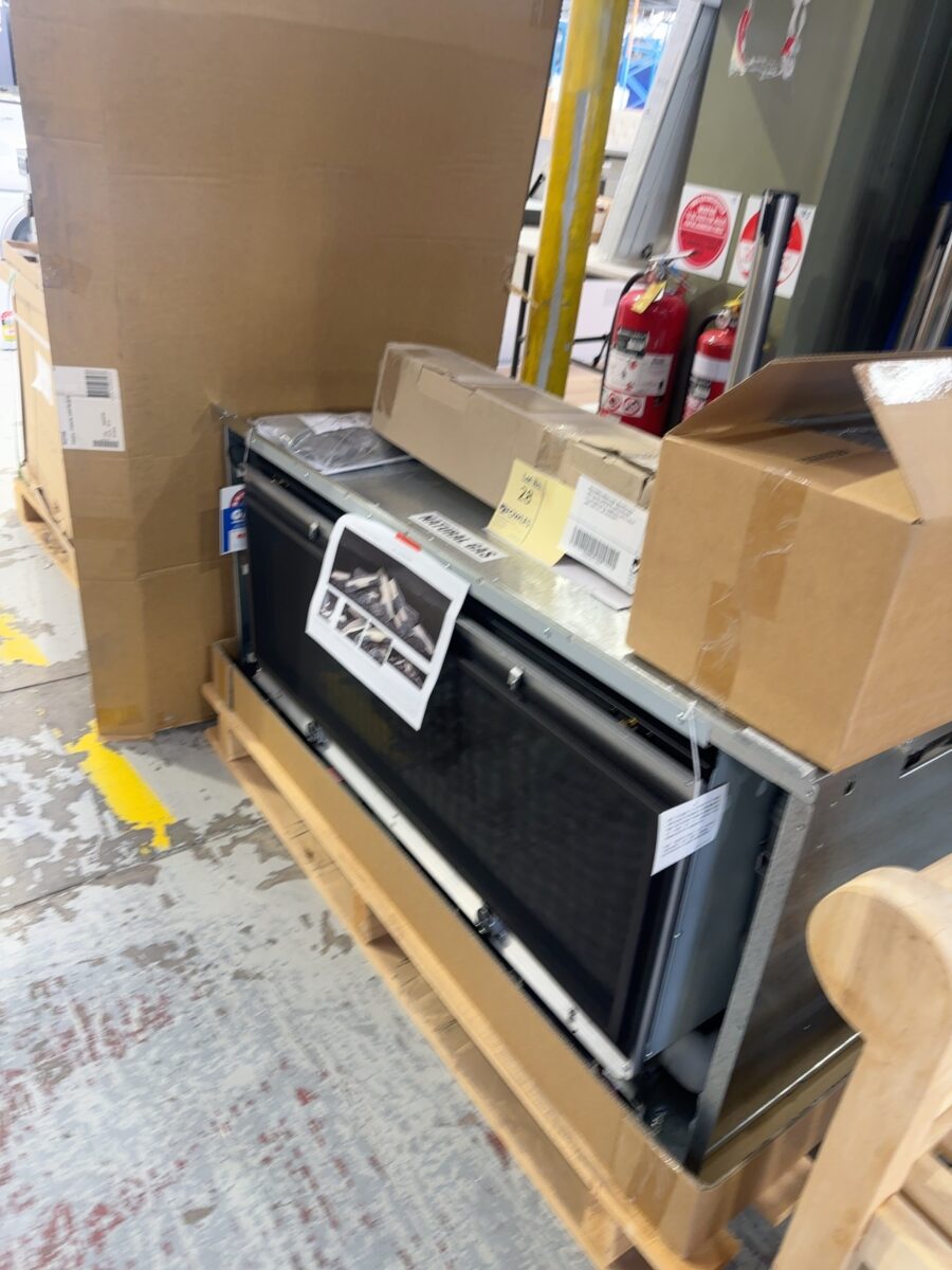 NEW RINNAI INBUILT GAS LOG FIRE PLACE WITH BLACK SURROUNE, RHFE1250 RRP$11,700 SOLD AS IS, COMPLETE WITH FASCIA AND LOGS ETC, NO WARRANTY