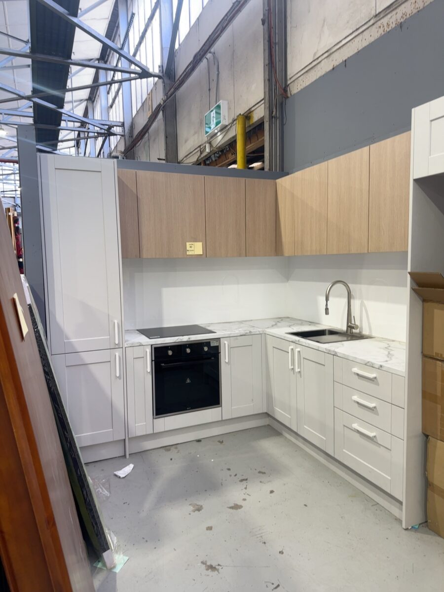 EX DISPLAY L SHAPE KITCHEN WITH LAMINATE BENCH, GREY SQUARE ROUTED PROFILE DOORS, OAK OVERHEADS, WITH 540MM PANTRY AND 800MM FRIDGE SPACE, INCLUDES PULL OUT TAP, SINK, INALTO OVEN & CERAMIC COOKTOP, SOLD AS IS, **BIDDER TO REMOVE** ALL SOLD AS IS NO WARRANTY