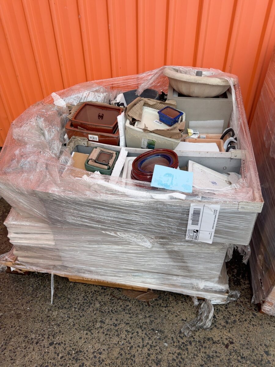 PALLET OF ASSORTED PLANT POTS & SAUCERS SOLD AS IS