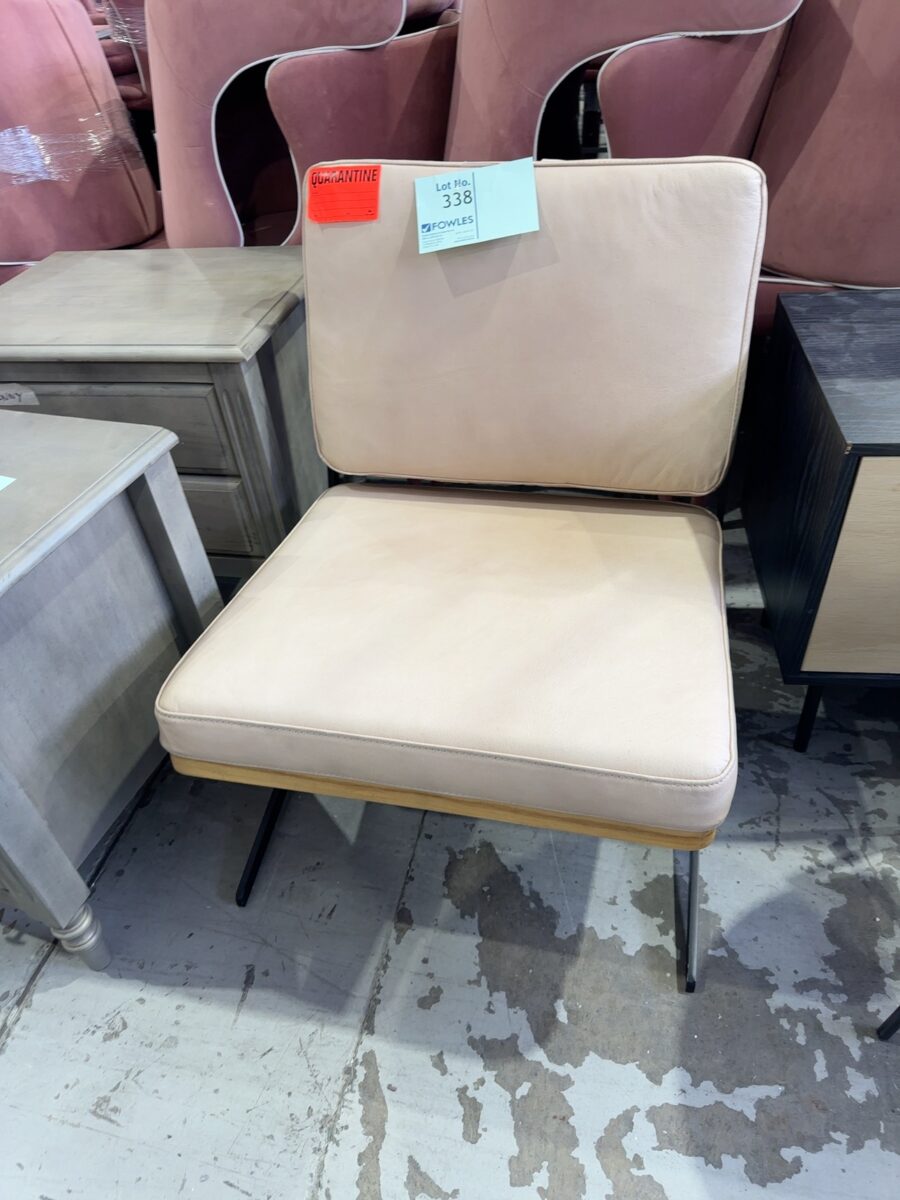EX HIRE BEIGE LEATHER LOW FRAME CHAIR, SOLD AS IS