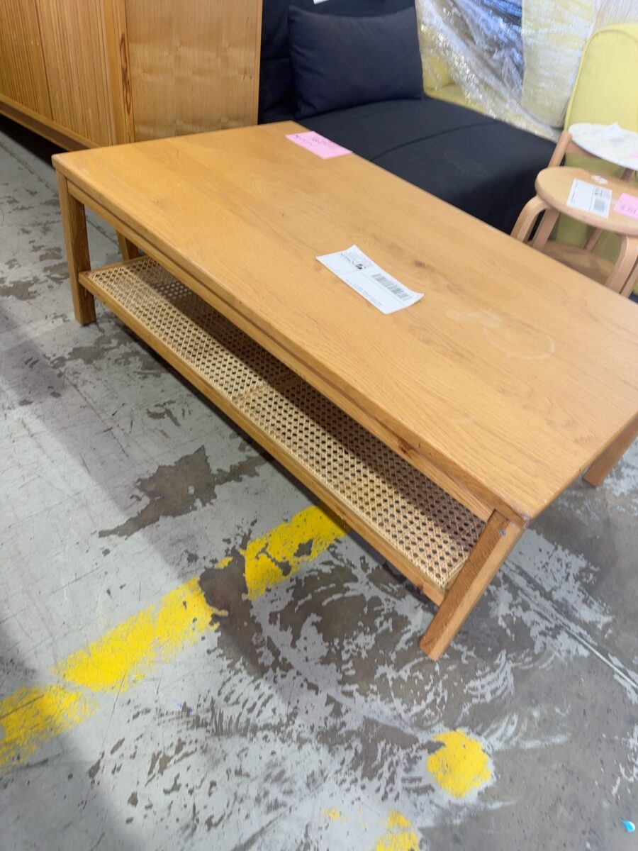 EX STAGING - COFFEE TABLE WITH RATTAN BASE, STAINS ON WOOD, SOLD AS IS