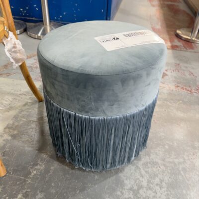 EX STAGING - LIGHT BLUE VELVET FRINGED ROUND OTTOMAN SOLD AS IS