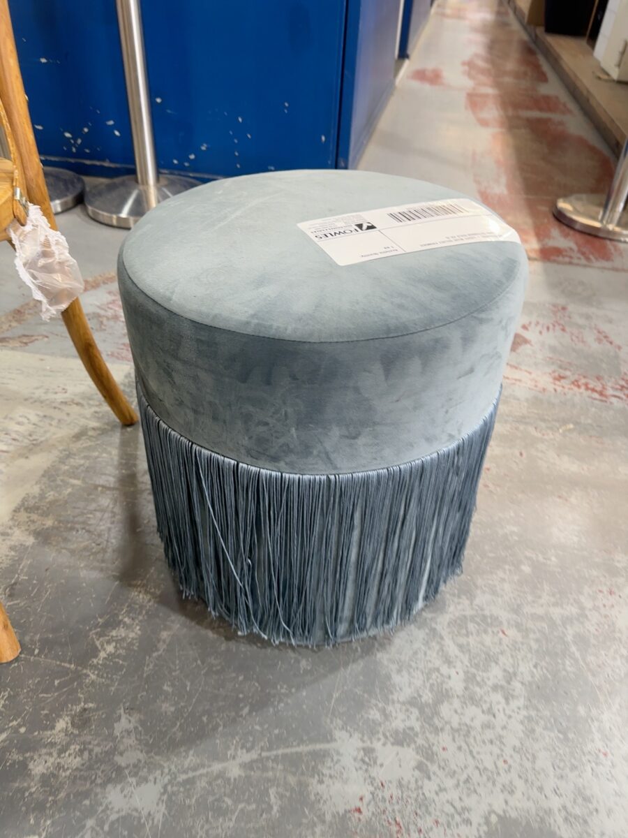 EX STAGING - LIGHT BLUE VELVET FRINGED ROUND OTTOMAN SOLD AS IS