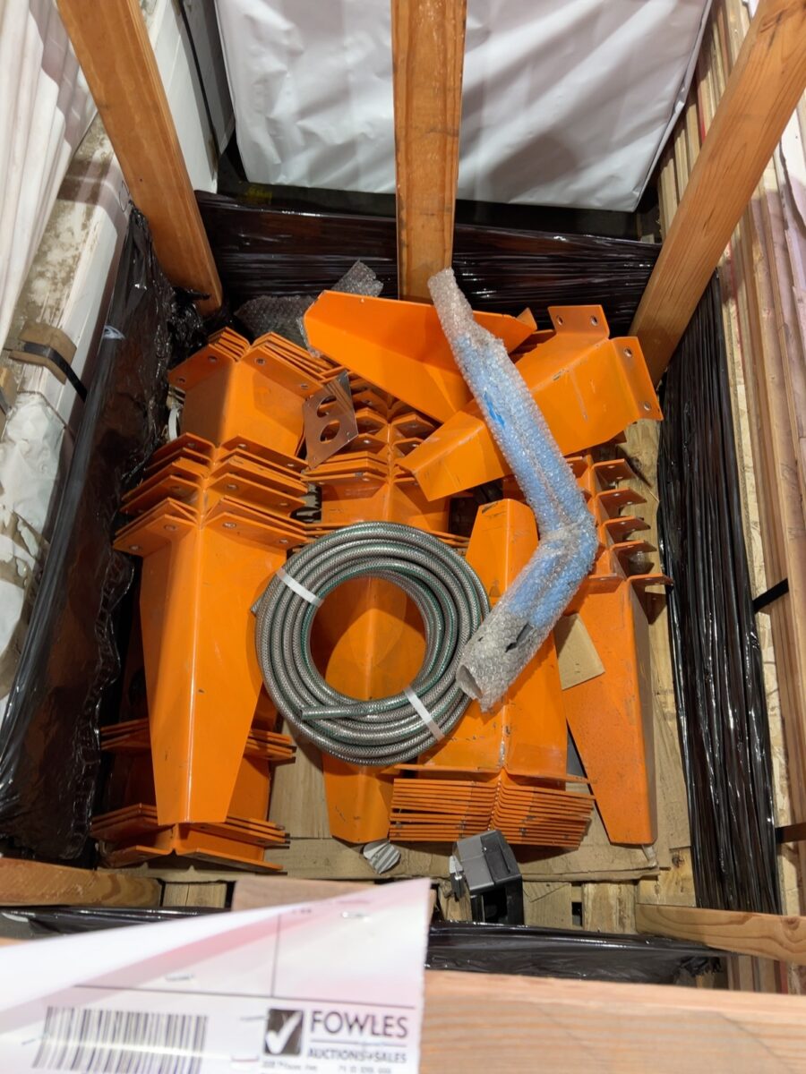 CRATE CONTAINING LARGE METAL ORANGE BRACKETS