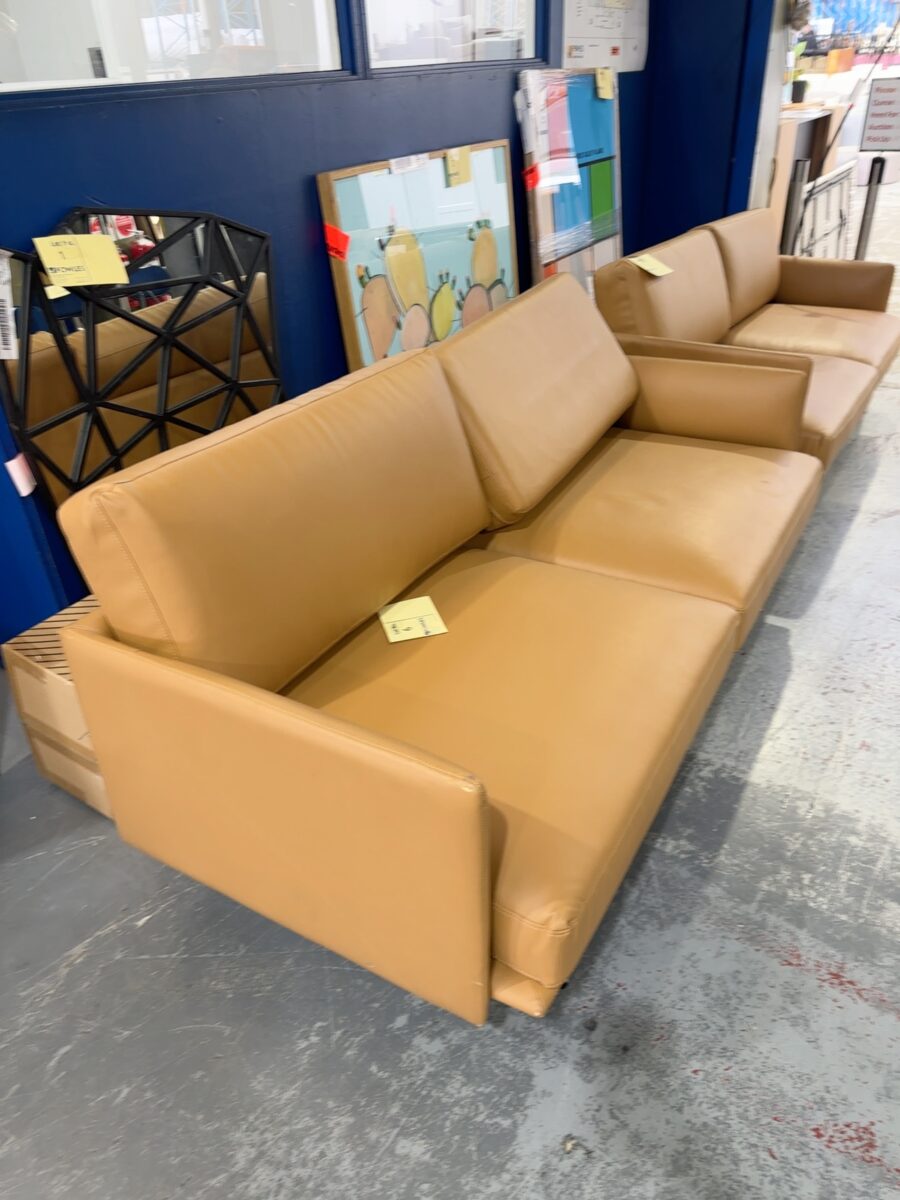 EX STAGING HIRE - TAN VINYL MID CENTURY STYLE 2 SEATER COUCH, SOLD AS IS **SOME SMALL MARKS, RUBS, SCRATCHES**