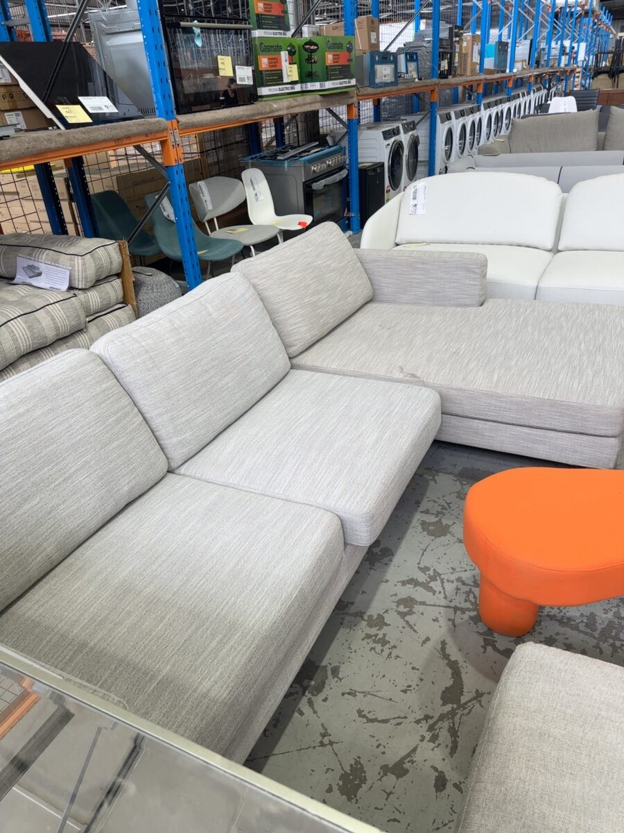 EX STAGING HIRE - LIGHT GREY COUCH WITH CHAISE, SOLD AS IS