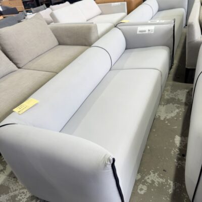 EX STAGING HIRE - GREY SOFA WITH BLACK PIPING, 2.5 SEATER SOLD AS IS