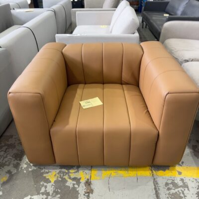 EX STAGING HIRE - TAN VINYL ARMCHAIR SOLD AS IS