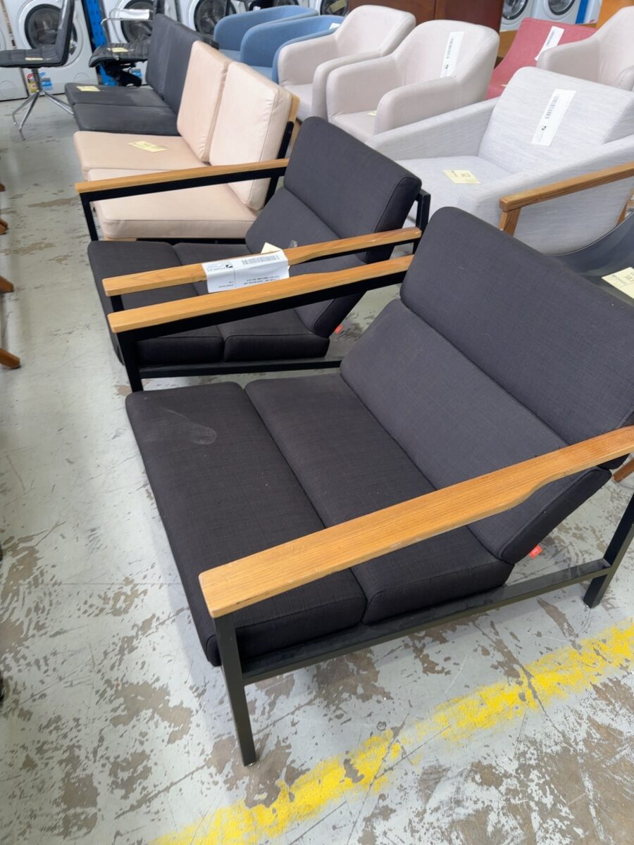 EX STAGING HIRE - BLACK MATERIAL ARM CHAIR WITH TIMBER ARMS, SOLD AS IS