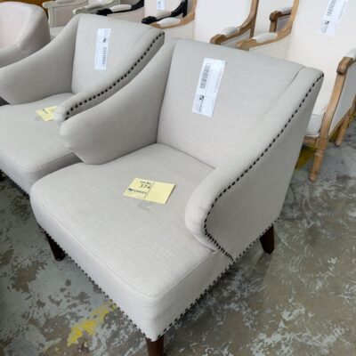 EX STAGING HIRE - BEIGE MATERIAL ARMCHAIR WITH STUD DETAIL, SOLD AS IS