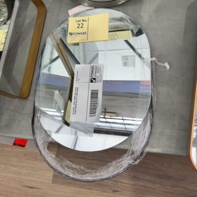 EX STAGING - SMALL OBLONG METAL BLACK FRAMED MIRROR SOLD AS IS, SOME DAMAGE