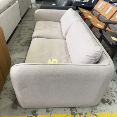 EX STAGING - LIGHT BEIGE 2.5 SEATER COUCH SOLD AS IS