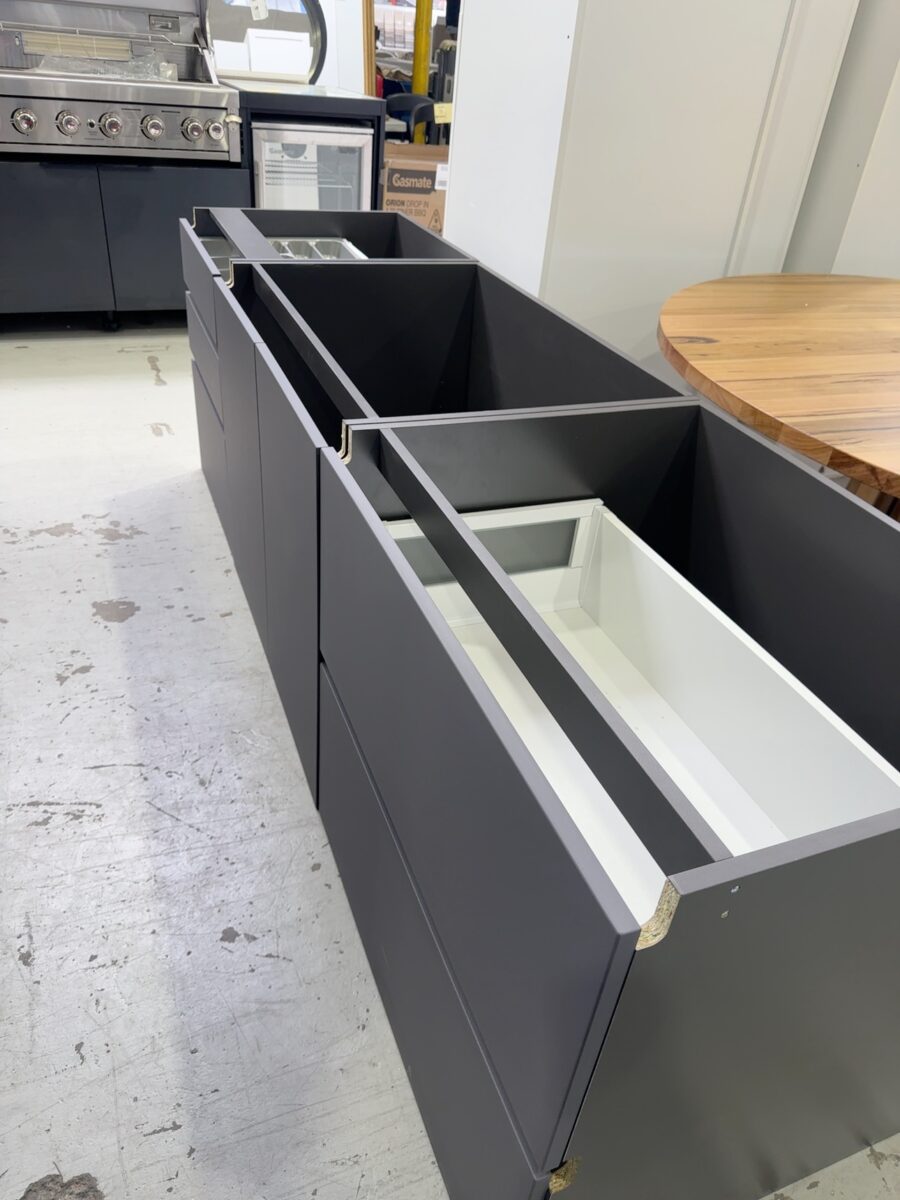 SAMPLE KITCHEN - DARK GREY SATIN GALLEY KITCHEN WITH BLUM DRAWERS, INLCUDES PULL OUT PANTRY MECHANISM BUT NO BASKETS, NO PANELS & NO FINGER PULL FILLER. SOLD AS IS