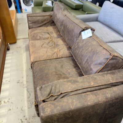 EX STAGING - BROWN LEATHER 3 SEATER COUCH WITH EXPOSED SEAMS, SOLD AS IS
