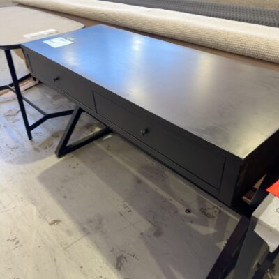 EX STAGING - 1270MM BLACK CROSS LEG DESK SOLD AS IS