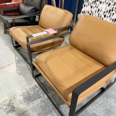EX STAGING - TAN LEATHER LOW SLUNG CHAIR, METAL FRAME, SOLD AS IS
