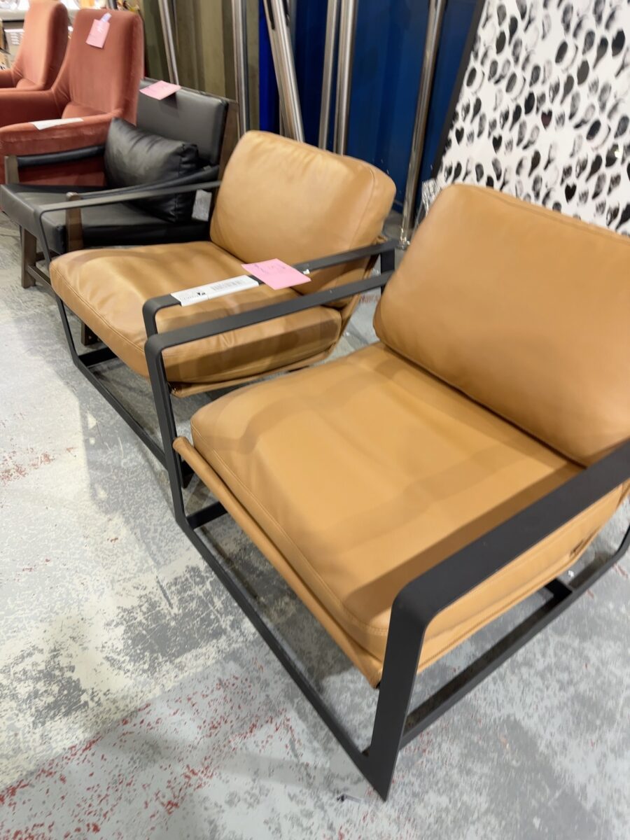 EX STAGING - TAN LEATHER LOW SLUNG CHAIR, METAL FRAME, SOLD AS IS