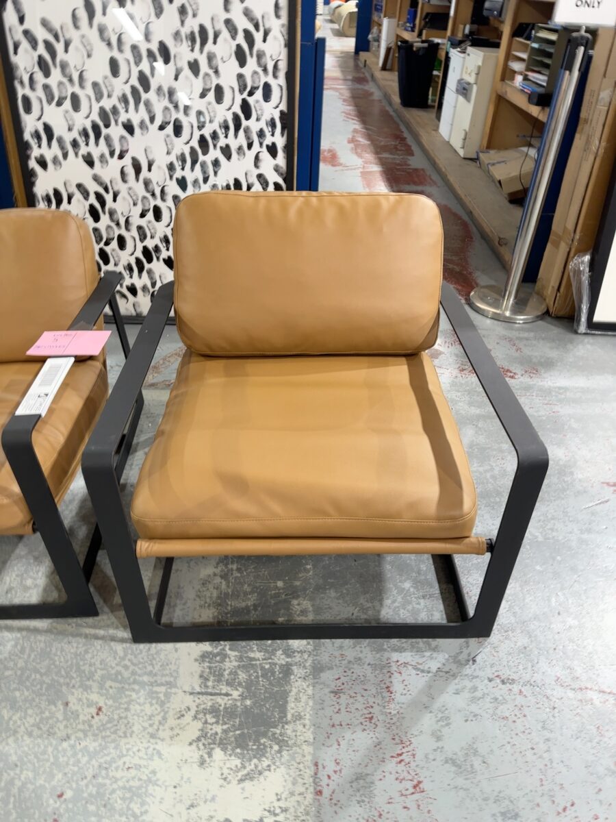 EX STAGING - TAN LEATHER LOW SLUNG CHAIR, METAL FRAME, SOLD AS IS