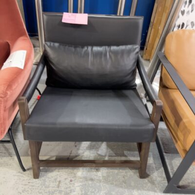 EX STAGING - BLACK LEATHER LOW SLUNG CHAIR, METAL FRAME, SOLD AS IS