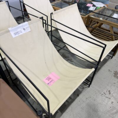 EX STAGING - CREAM MATERIAL SLING LOW CHAIR, METAL FRAME, SOLD AS IS