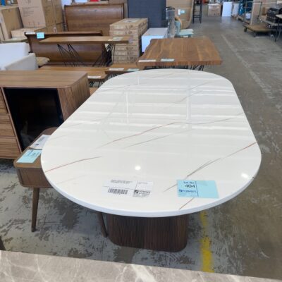 EX DISPLAY DENHAM 2100MM CURVED OVAL STONE TOP TABLE WITH LIGHT WALNUT VENEER PANELLED LEGS, SOLD AS IS
