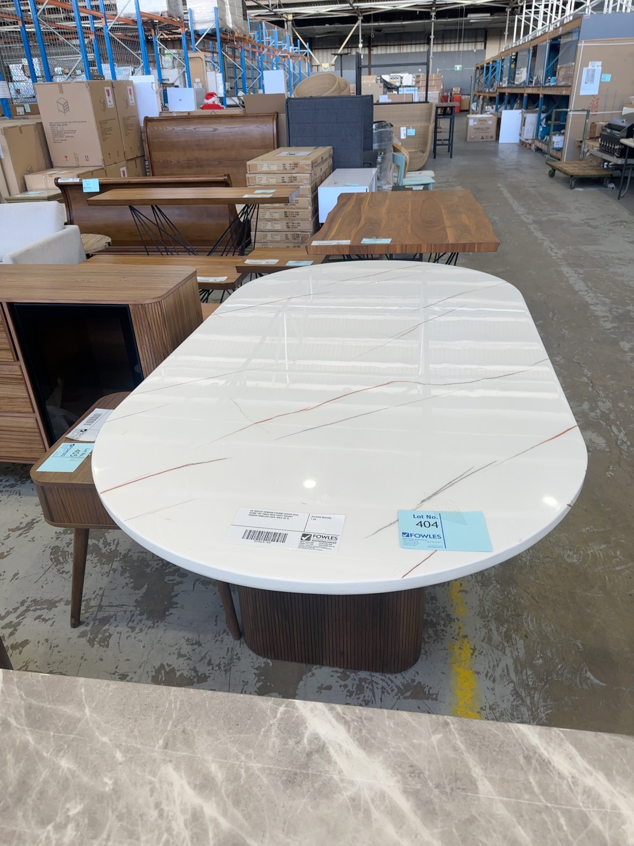 EX DISPLAY DENHAM 2100MM CURVED OVAL STONE TOP TABLE WITH LIGHT WALNUT VENEER PANELLED LEGS, SOLD AS IS
