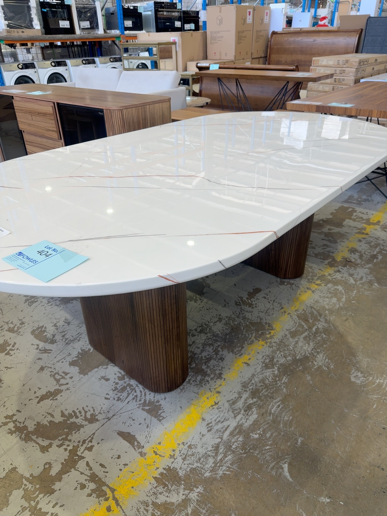 EX DISPLAY DENHAM 2100MM CURVED OVAL STONE TOP TABLE WITH LIGHT WALNUT VENEER PANELLED LEGS, SOLD AS IS