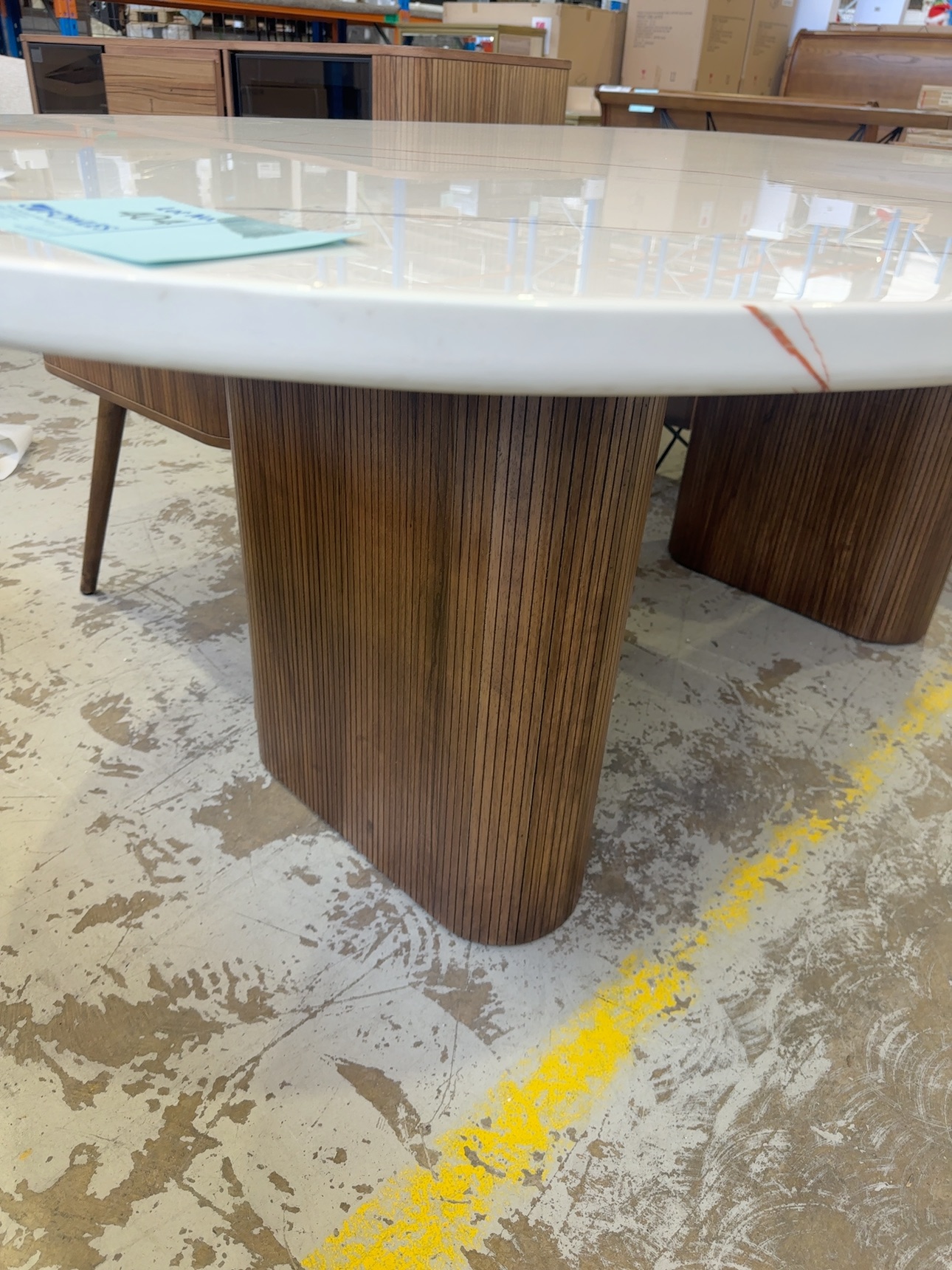 EX DISPLAY DENHAM 2100MM CURVED OVAL STONE TOP TABLE WITH LIGHT WALNUT VENEER PANELLED LEGS, SOLD AS IS