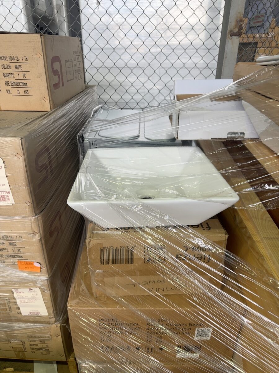 PALLET OF ASSORTED BATHROOM ACCESSORIES, INCLUDING WALL HUNG TIMBER MANHATTAN VANITY CABINET, OVEN WITH BROKEN DOOR, ASSORTED HANDHELD SHOWER RAILS, TOILET SEATS, VANITY BOWLS, STONE TOPS ETC
