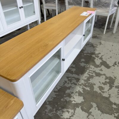 EX DISPLAY SORRENTO WHITE OAK VENEER 1800MM ENTERTAINMENT UNIT, OAK NATURAL FINISH TOP, SOLID LEGS, WITH CENTRAL SHELVES, GLASS DOORS EACH END, SOLD AS IS EX DISPLAY SORRENTO WHITE OAK VENEER 1800MM ENTERTAINMENT UNIT, OAK NATURAL FINISH TOP, SOLID LEGS, WITH CENTRAL SHELVES, GLASS DOORS EACH END, SOLD AS IS