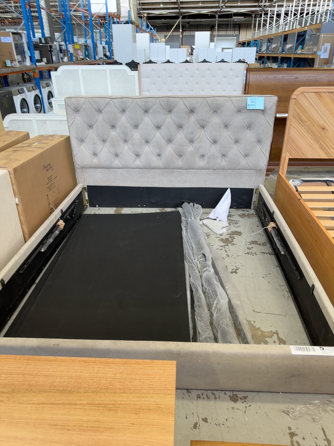 SAMPLE BEDFRAME - KING BED WITH GASLIFT, SOLD AS IS SAMPLE BEDFRAME - KING BED WITH GASLIFT, SOLD AS IS