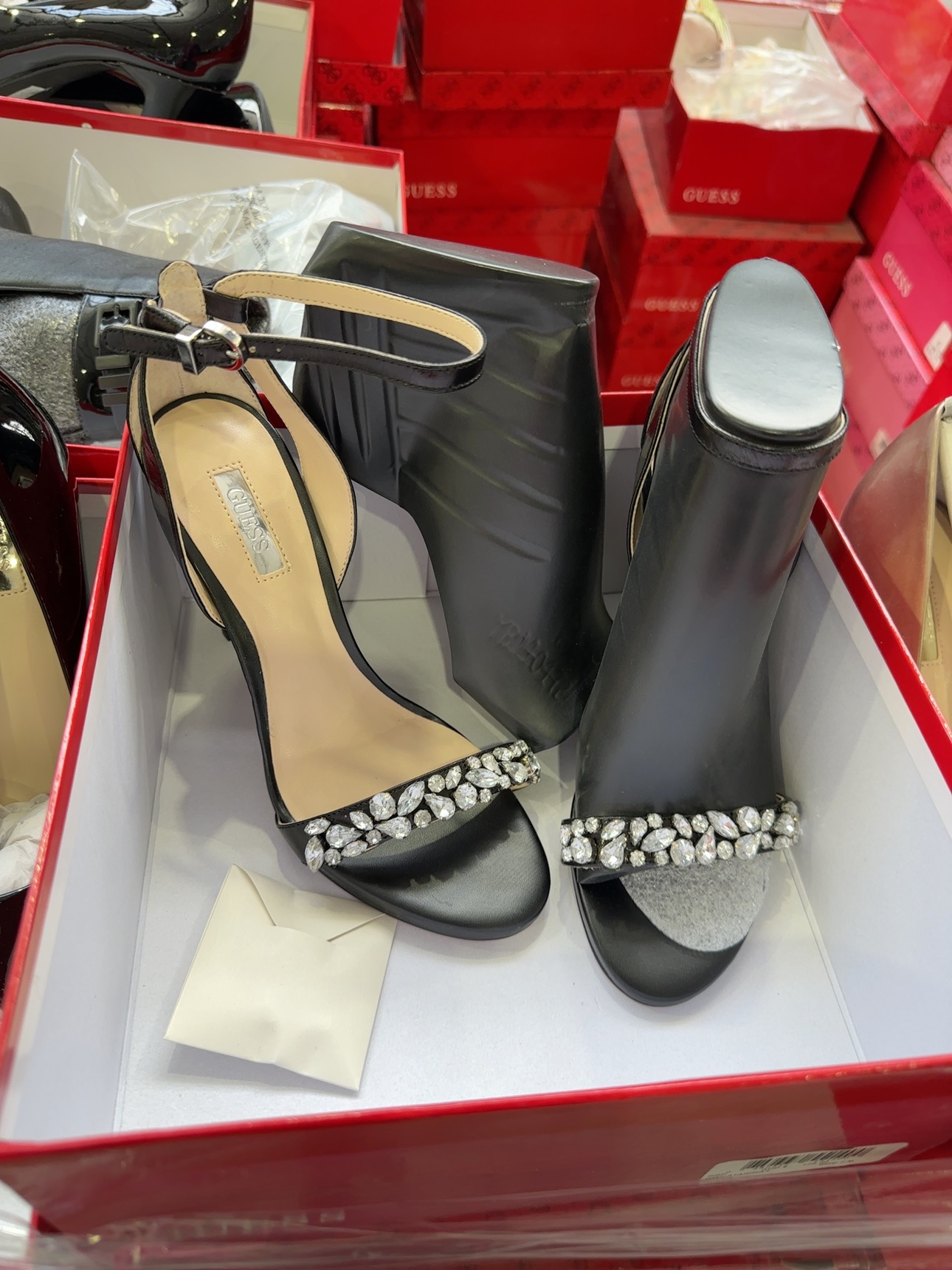 PALLET OF BULK WOMENS GUESS SHOES, ASSORTED SIZES, COLOURS AND STYLES, SOLD BY THE PALLET - QTY OF 65 PAIRS, SOLD AS IS PALLET OF BULK WOMENS GUESS SHOES, ASSORTED SIZES, COLOURS AND STYLES, SOLD BY THE PALLET - QTY OF 65 PAIRS, SOLD AS IS