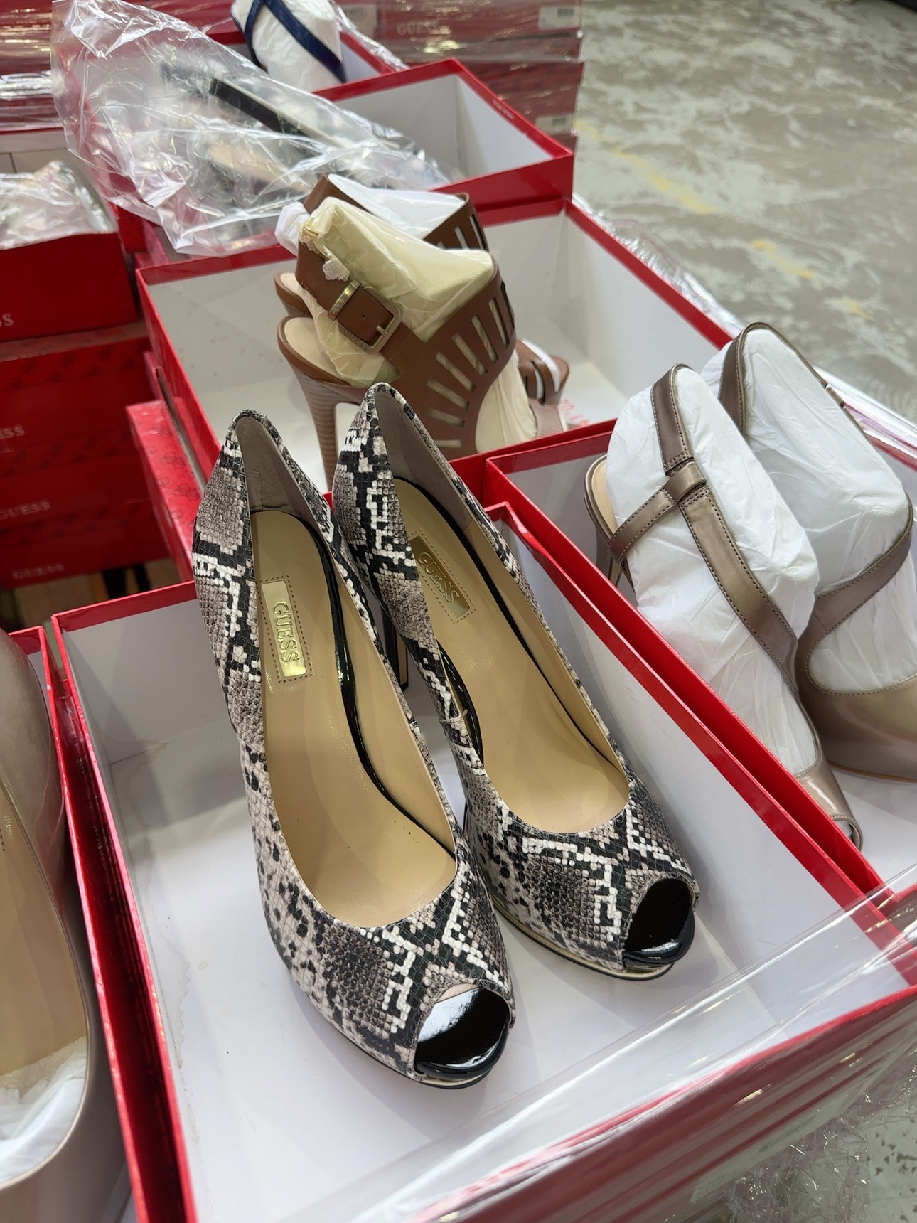 PALLET OF BULK WOMENS GUESS SHOES, ASSORTED SIZES, COLOURS AND STYLES, SOLD BY THE PALLET - QTY OF 65 PAIRS, SOLD AS IS PALLET OF BULK WOMENS GUESS SHOES, ASSORTED SIZES, COLOURS AND STYLES, SOLD BY THE PALLET - QTY OF 65 PAIRS, SOLD AS IS