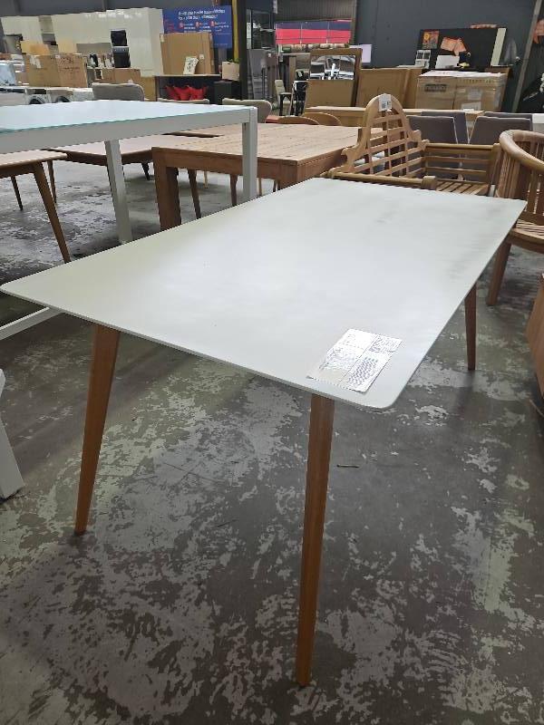 EX STAGING, WHITE LAMINATE RECTANGLE DINING TABLE WITH TIMBER LEGS SOLD AS IS EX STAGING, WHITE LAMINATE RECTANGLE DINING TABLE WITH TIMBER LEGS SOLD AS IS
