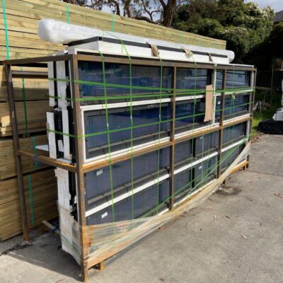 METAL STILLAGE CONTAINING APPROX 17 ASST'D FIXED ALUMINIUM WINDOWS IN VARIOUS SIZES