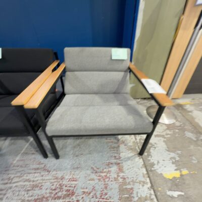 EX STAGING - GREY ARMCHAIR WITH TIMBER ARMS, SOLD AS IS EX STAGING - GREY ARMCHAIR WITH TIMBER ARMS, SOLD AS IS